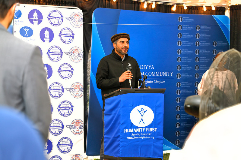 Haris Raja speaks at the podium.