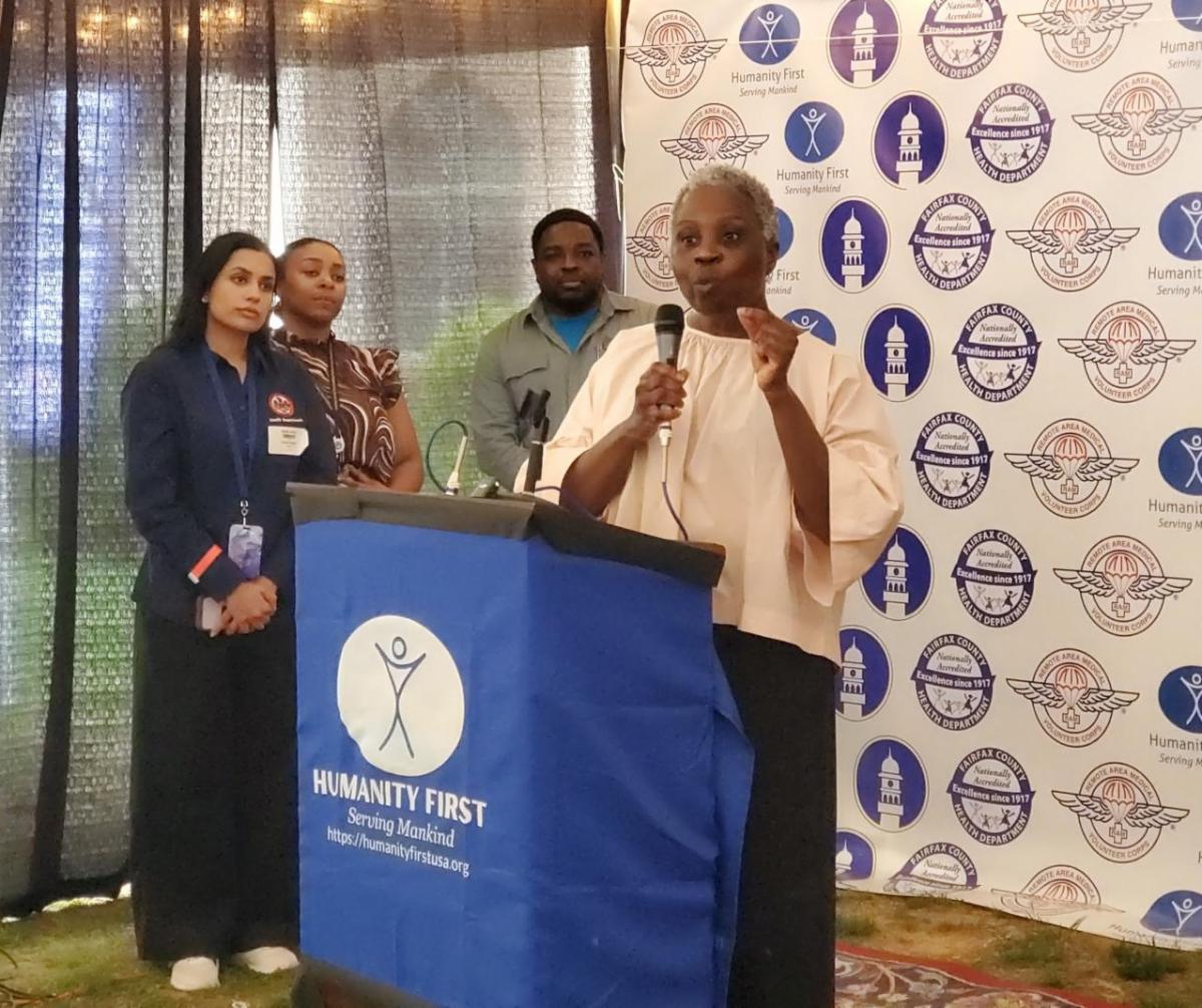 Dr. Gloria Addo-Ayensu speaks at the podium.