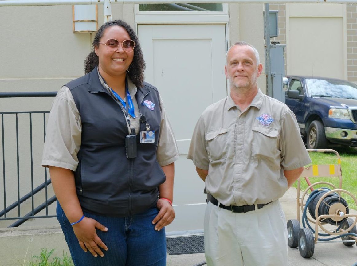 Two leaders of Remote Area Medical pose for a picture during clinic set up.