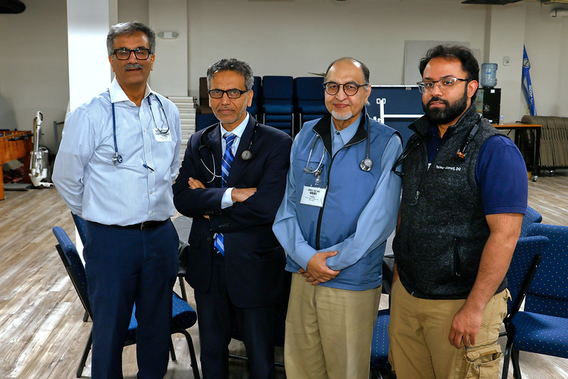 Four volunteer physicians giving their time to the clinic.