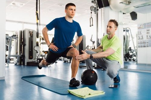 an athletic trainer helping a patient