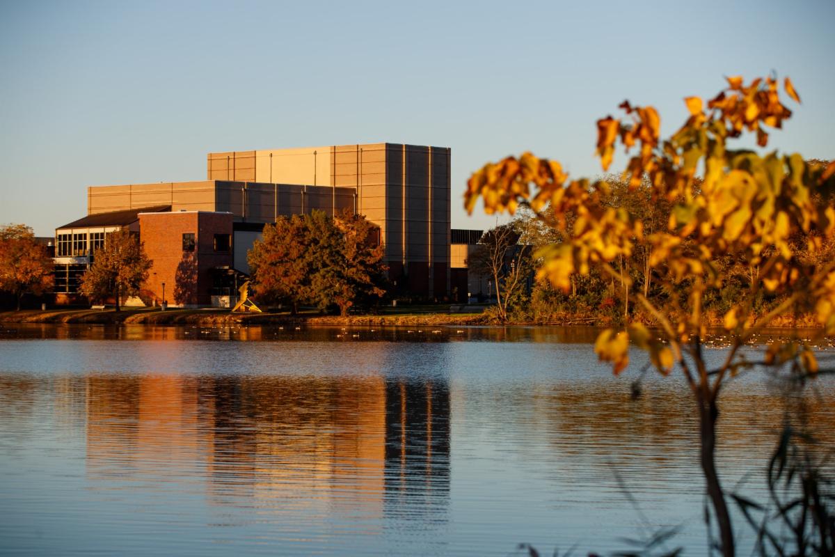 campus buildings pond and autumn leaves