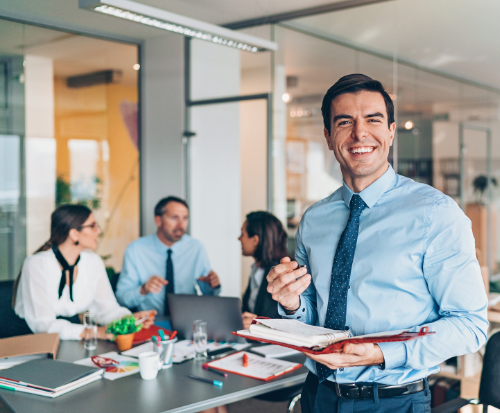 an image of an office manager standing in an office space
