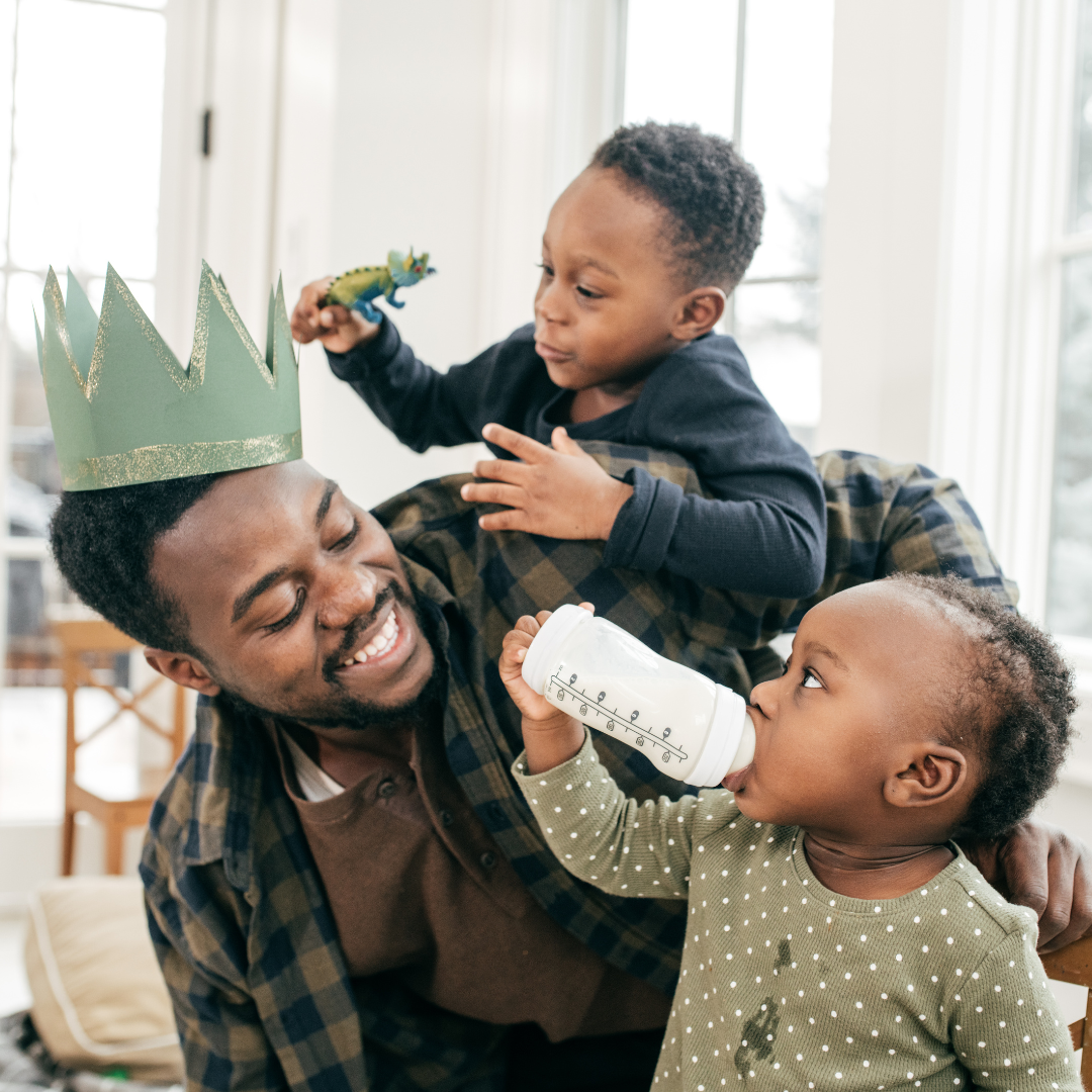 father playing with two kids