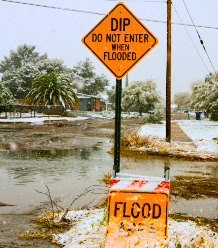 Thawing snow turning to floods after a rare winter storm in Tucson Arizona