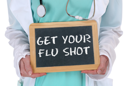 Get your flu shot disease ill illness healthy health doctor nurse with sign