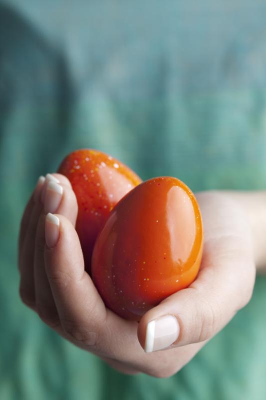 hand_two_red_easter_eggs.jpg