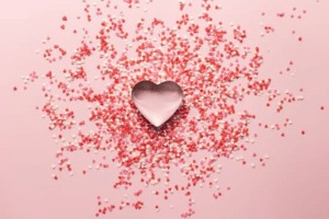 heart shaped cookie cutter with confetti surrounding