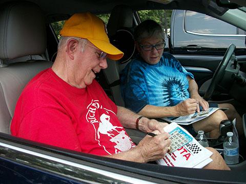 Older couple playing car bingo