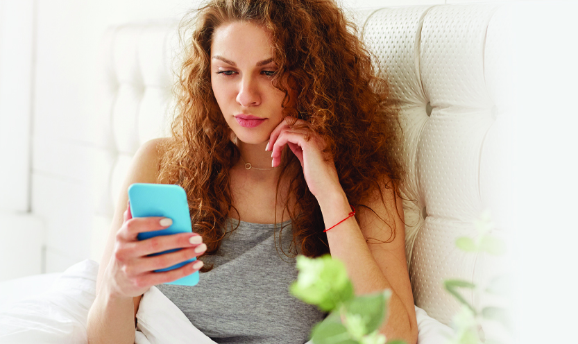 woman looking at phone