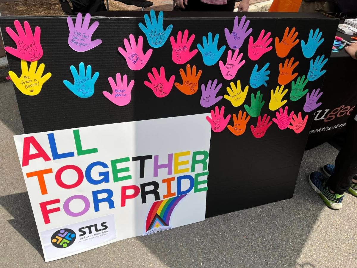All Together For Pride Handprints with signatures and messages board