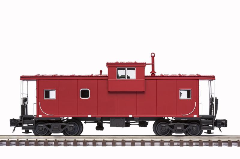 A red railroad caboose on train track.