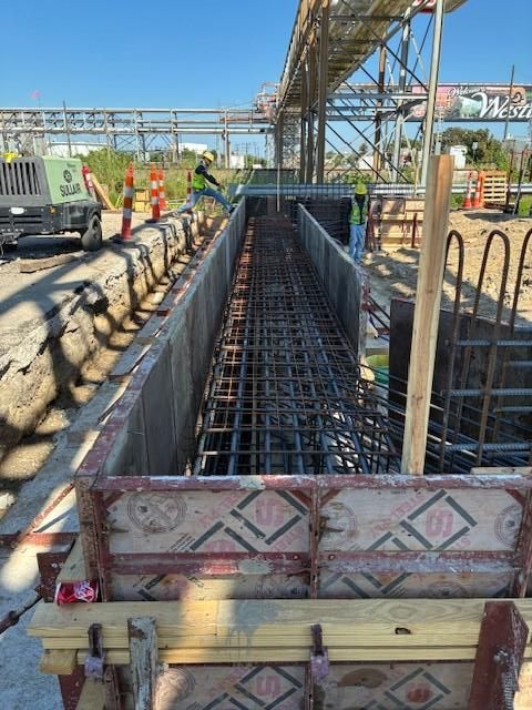 Pre construction activities with rebar inside a concrete form for the bridge foundation