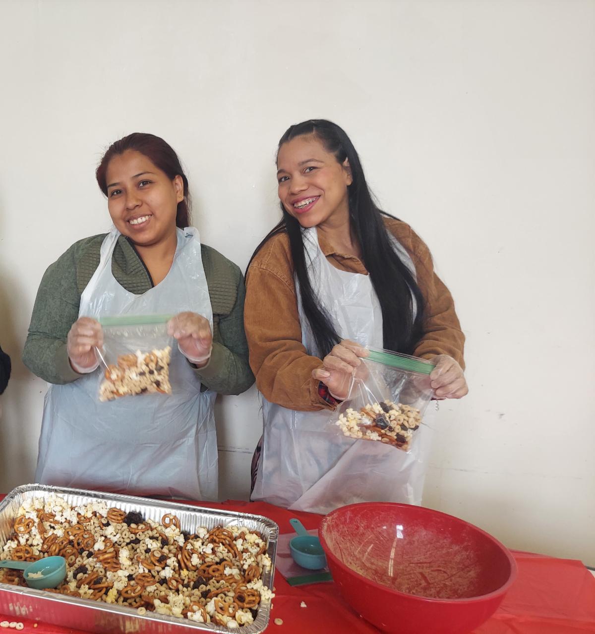 Moms making healthy snacks in our nutrition classes in partnership with Weill Cornell Cooperative Extension
