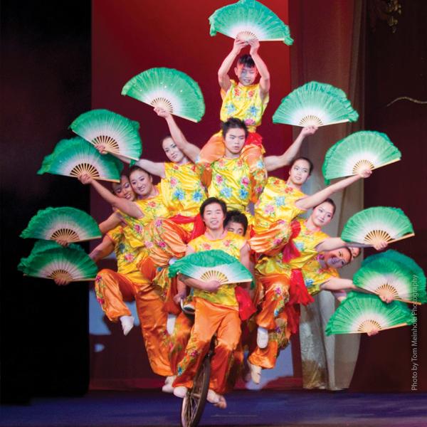 The Peking Acrobats balancing on a bicycle