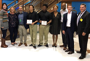 Two intern students along with Amanda Wallace, Mindy McCartney, Joseph Mack, Genevieve Jones-Wright, Brandon Steppe, Nathan Head and Supt. Paul Gothold.