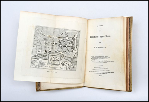 A book open to the title page called A Guide to Stratford Upon Avon