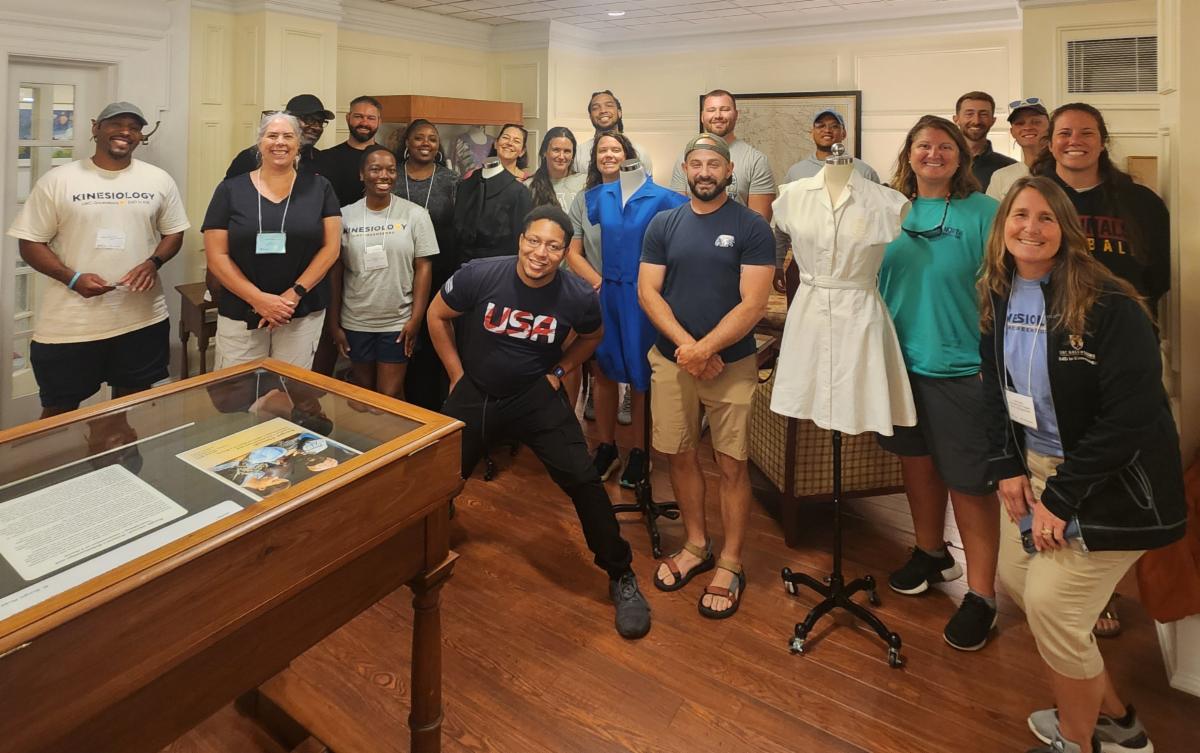 A group of people standing in the Hodges Reading Room.