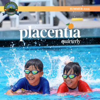 Cover of Placentia Quarterly Summer 2026 featuring two children wearing sunglasses and smiling while swimming in a pool.