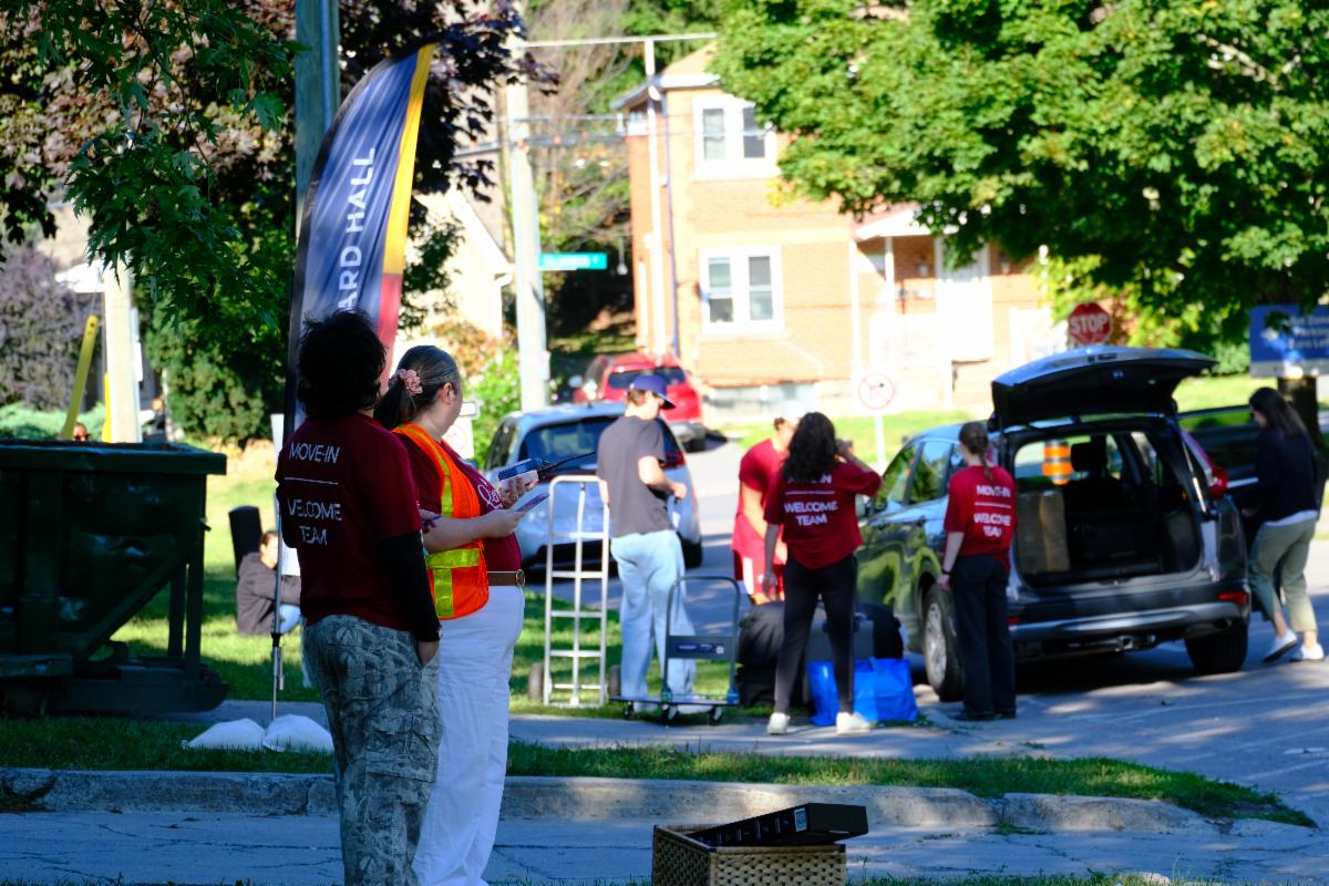 Students and their supporters unload their belongings on move-in day