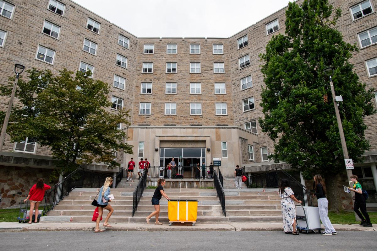 Students, volunteers, and families move into Victoria Hall.