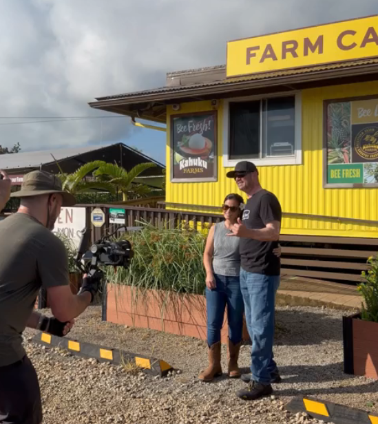 Photographer shoots a photo of Kylie Matsuda-Lum and Judah Matsuda of Kahuku farms as part of the recent HTA campaign to boost visitor confidence. 