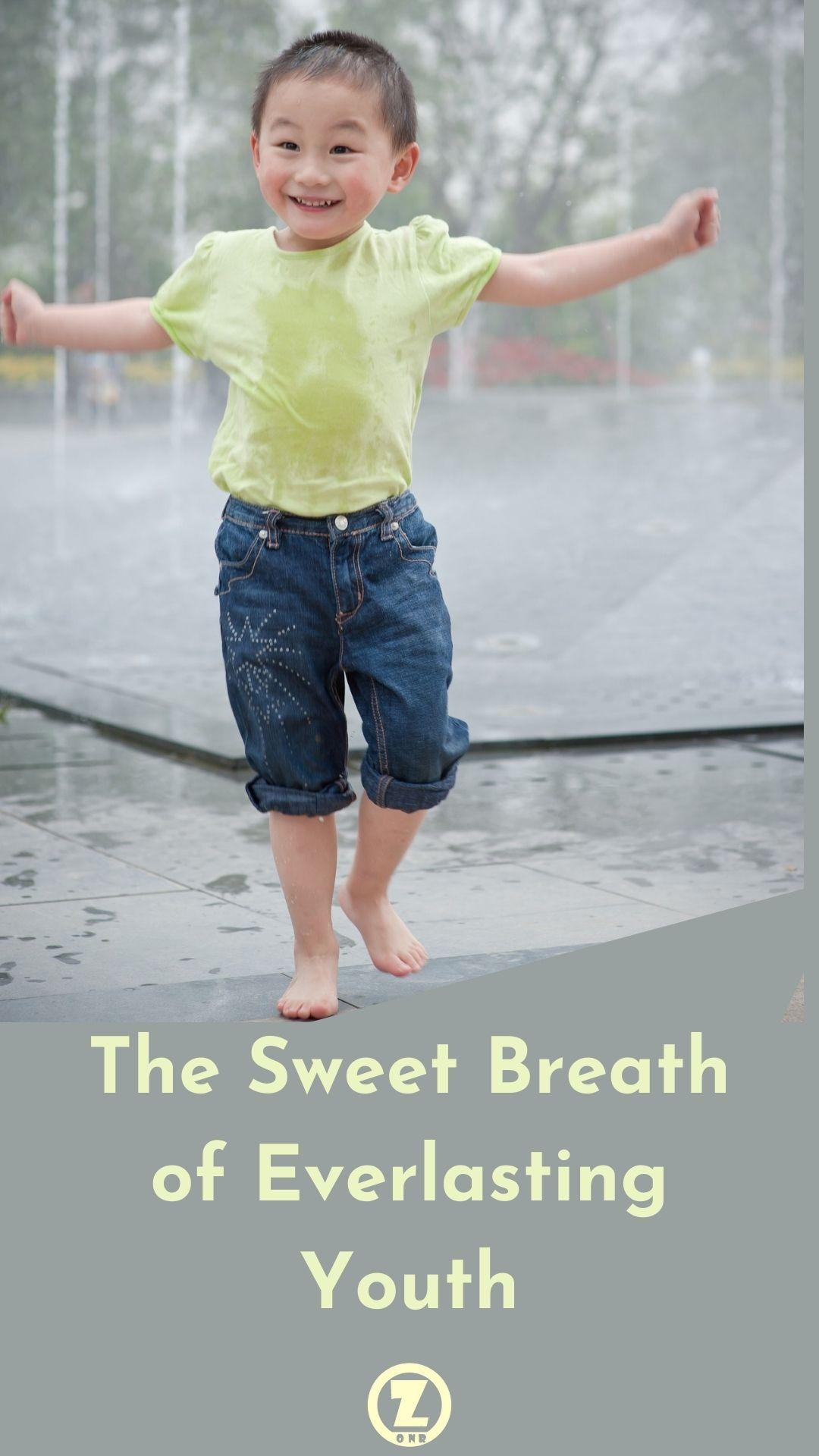 Happy Asian boy playing in a ground fountain w/ sfz title