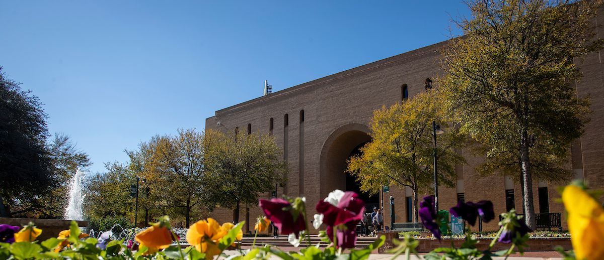 Exterior of Willis Library surrounded by spring flowers