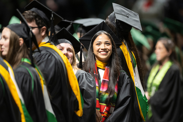 UNT graduate smiling at commencement