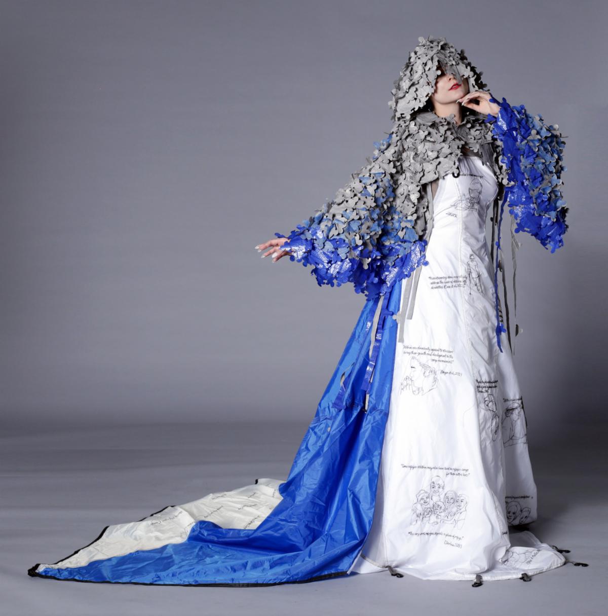 Model wearing dress made by professor Chanjuan Chen