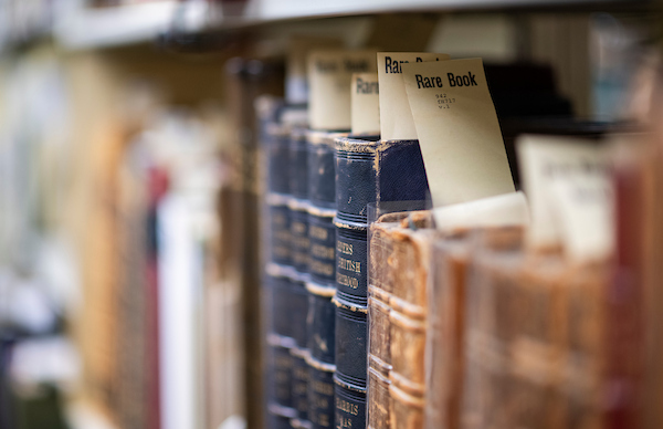 Closeup photo of UNT Libraries rare books on a shelf