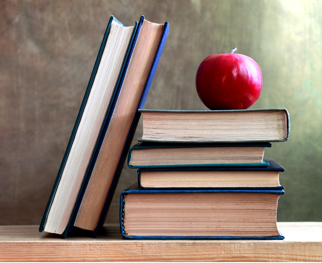 Apple on top of a stack of books