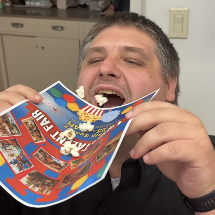 Cory funneling popcorn into his mouth