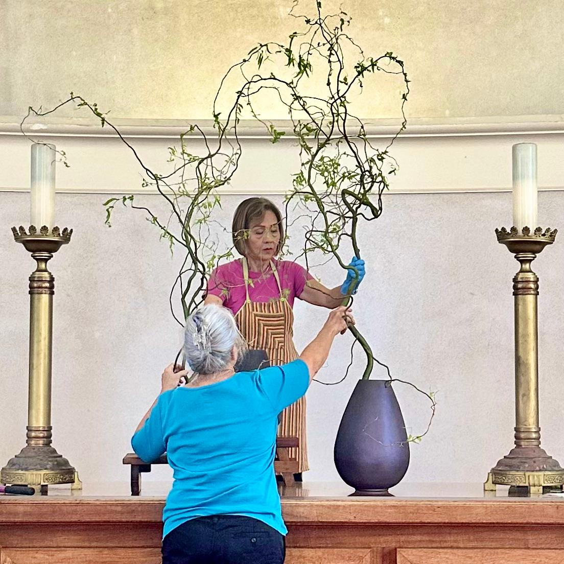 Arranging flowers for the sanctuary