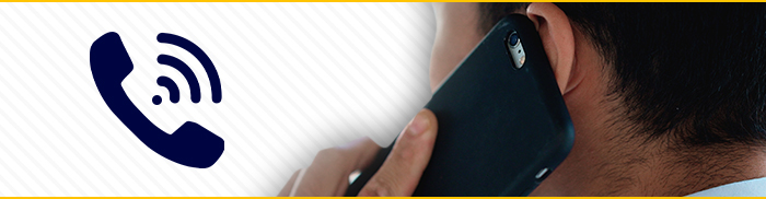 Graphic with a phone icon on the left and a photo of a person taking a phone call on the right.