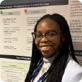 photo of family medicine resident Adjoa Kusi-Appiah, MD, presenting her poster at the 2025 MAFP Innovation & Research Forum