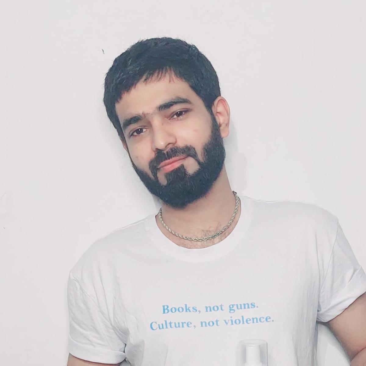 a man with a beard and white t-shirt