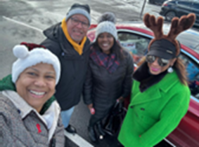 A group of NOBLE NJ members smiling in Christmas attire