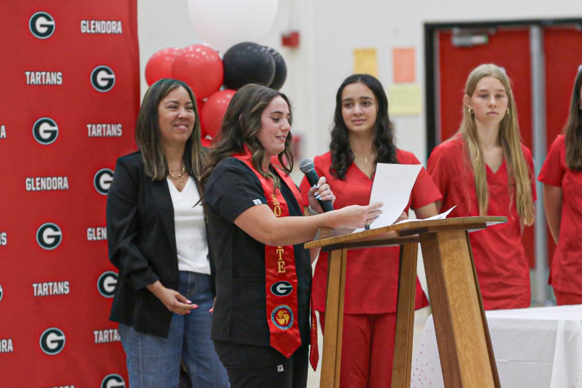 CTE student standing at a podium giving a speech