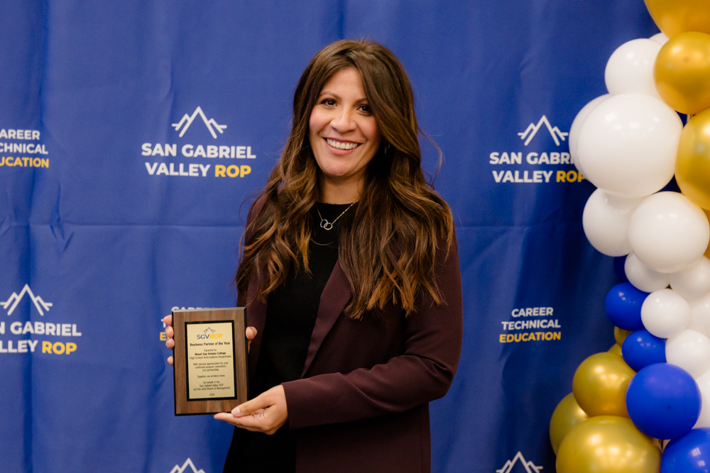 SGVROP Business Partner holding up a plaque