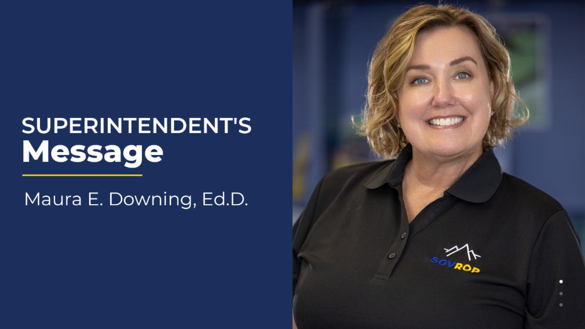 Portrait of Maura Downing wearing a black polo shirt with the ROP logo on it. 