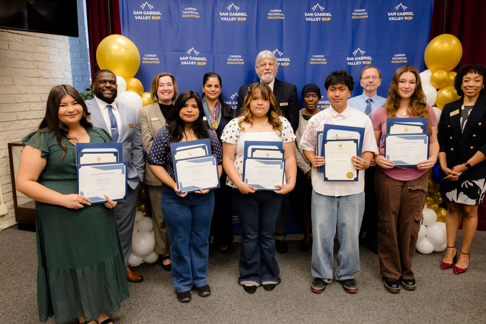 SGVROP Scholarship Recipients holding their certificates posing with the ROP Board