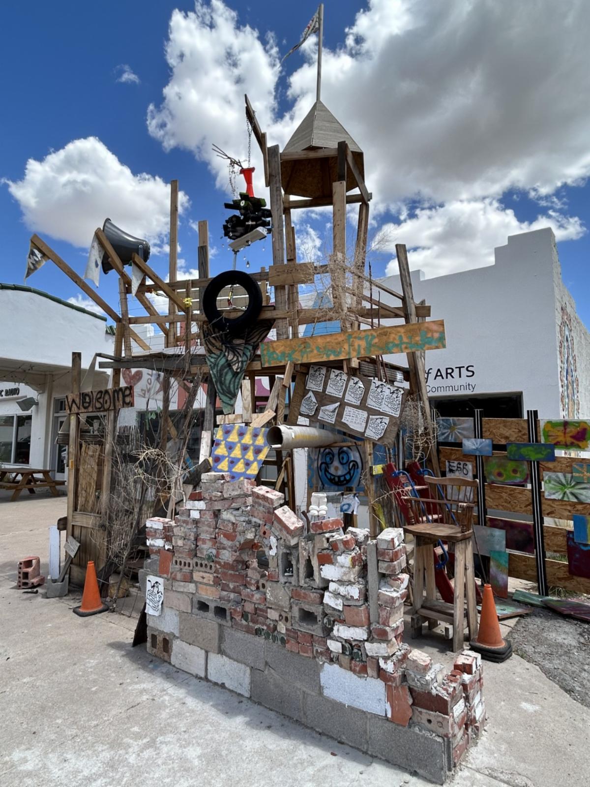 A view of the fort young people built from various salvaged and recycled materials.