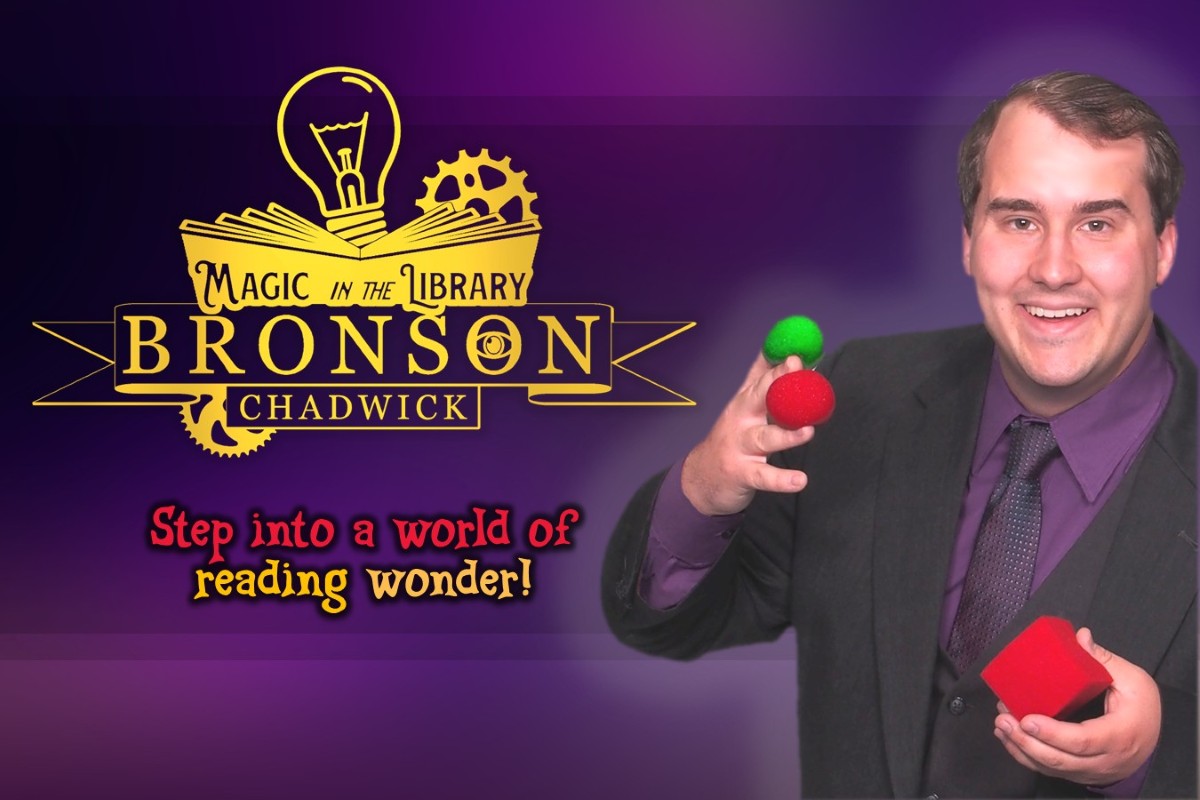 Bronson Chadwick of Magic in the Library poses with a few small colorful props.
