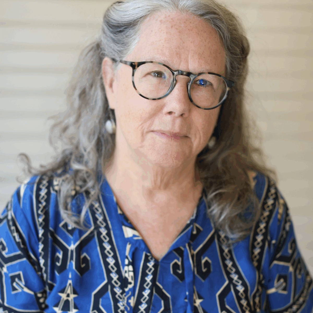Celia Hughes looks at the camera with a slightly tilted head.