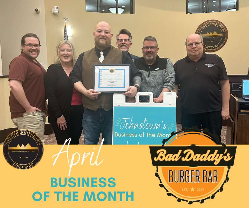 April Business of the Month "Bad Daddy's Burger Bar". The photo is of the council and the business. 