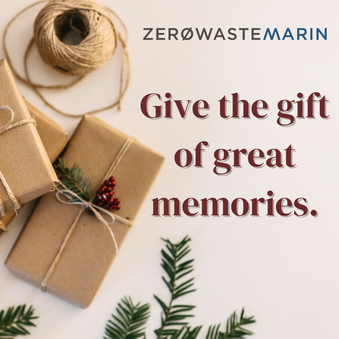 Small stack of presents wrapped in craft paper with the text give the gift of great memories