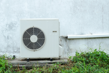 Heat pump HVAC on outside of a home 