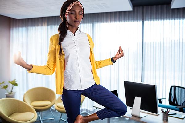 image of woman meditating in office