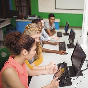 image of students on laptops